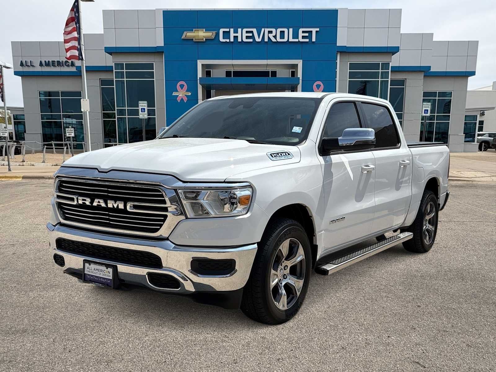 2024 RAM 1500 Laramie in Wht/White — front three-quarter view