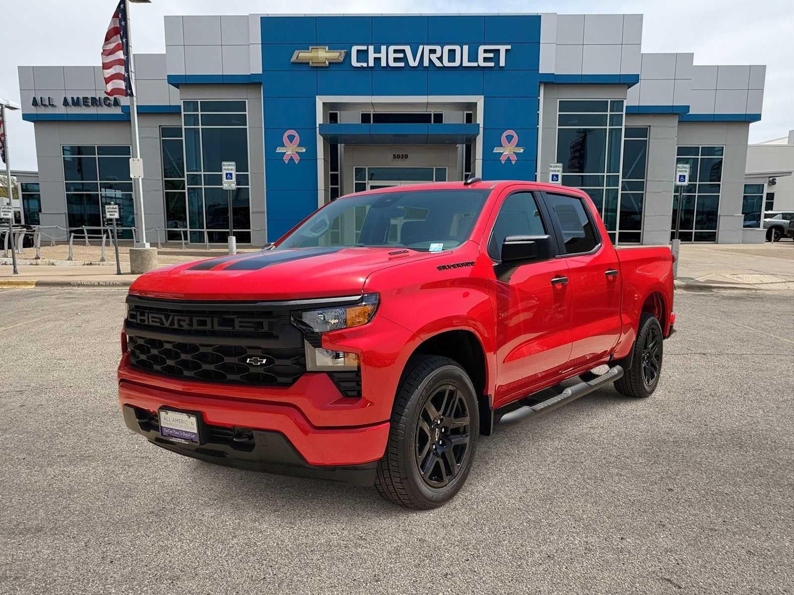 2026 Chevrolet Silverado 1500 Custom in Red Hot — front three-quarter view